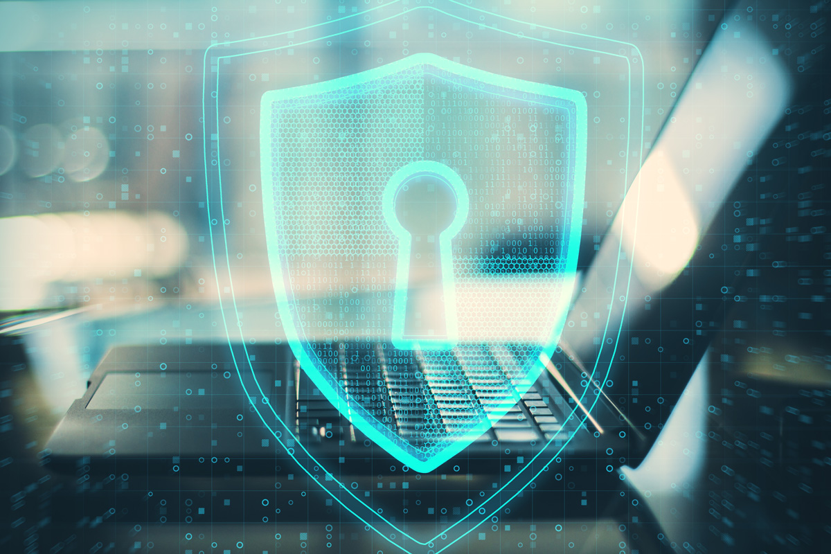 Cybersecurity Shield protecting a laptop